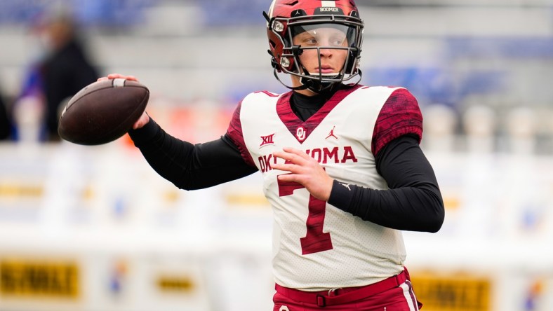 Oct 23, 2021; Lawrence, Kansas, USA; Oklahoma Sooners quarterback Spencer Rattler (7) warms up before the game against the Kansas Jayhawks at David Booth Kansas Memorial Stadium. Mandatory Credit: Jay Biggerstaff-USA TODAY Sports