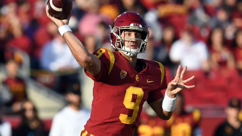 Oct 30, 2021; Los Angeles, California, USA; Southern California Trojans quarterback Kedon Slovis (9) throws against the Arizona Wildcats during the first half at United Airlines Field at Los Angeles Memorial Coliseum. Mandatory Credit: Gary A. Vasquez-USA TODAY Sports