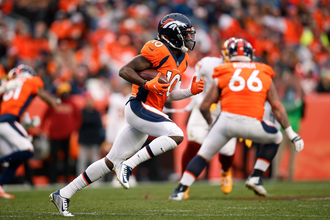 Oct 31, 2021; Denver, Colorado, USA; Denver Broncos wide receiver Jerry Jeudy (10) runs the ball in the fourth quarter against the Washington Football Team at Empower Field at Mile High. Mandatory Credit: Isaiah J. Downing-USA TODAY Sports