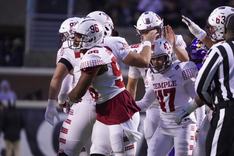 Nov 6, 2021; Greenville, North Carolina, USA;  Temple Owls place kicker Rory Bell (47) is congratulated by his teammates after his second half field goal against the East Carolina Pirates at Dowdy-Ficklen Stadium. Mandatory Credit: James Guillory-USA TODAY Sports