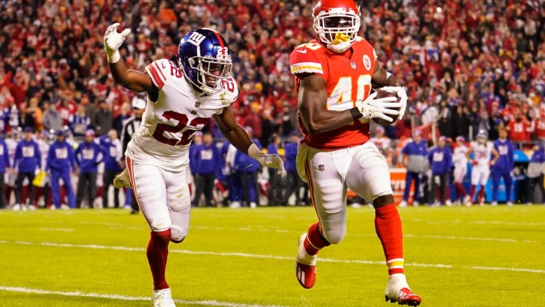 Nov 1, 2021; Kansas City, Missouri, USA; Kansas City Chiefs running back Derrick Gore (40) runs for a touchdown against New York Giants cornerback Adoree' Jackson (22) during the first half at GEHA Field at Arrowhead Stadium. Mandatory Credit: Jay Biggerstaff-USA TODAY Sports