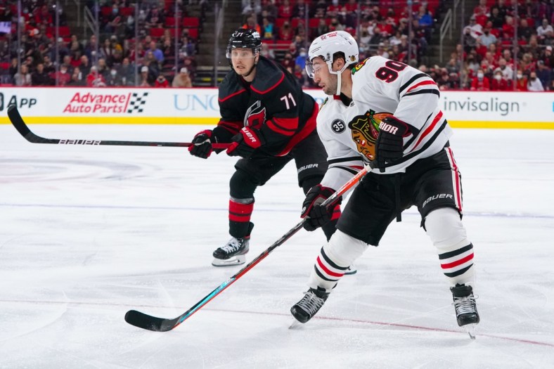 Oct 29, 2021; Raleigh, North Carolina, USA;  Chicago Blackhawks center Tyler Johnson (90) skates with the puck during the first period against the Carolina Hurricanes at PNC Arena. Mandatory Credit: James Guillory-USA TODAY Sports