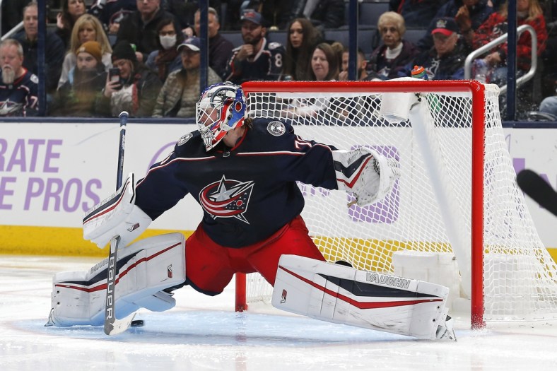Nov 12, 2021; Columbus, Ohio, USA; The shot from Washington Capitals right wing Garnet Hathaway (21) (not pictured) slides under the pad of Columbus Blue Jackets goalie Joonas Korpisalo (70) for a goal during the second period at Nationwide Arena. Mandatory Credit: Russell LaBounty-USA TODAY Sports