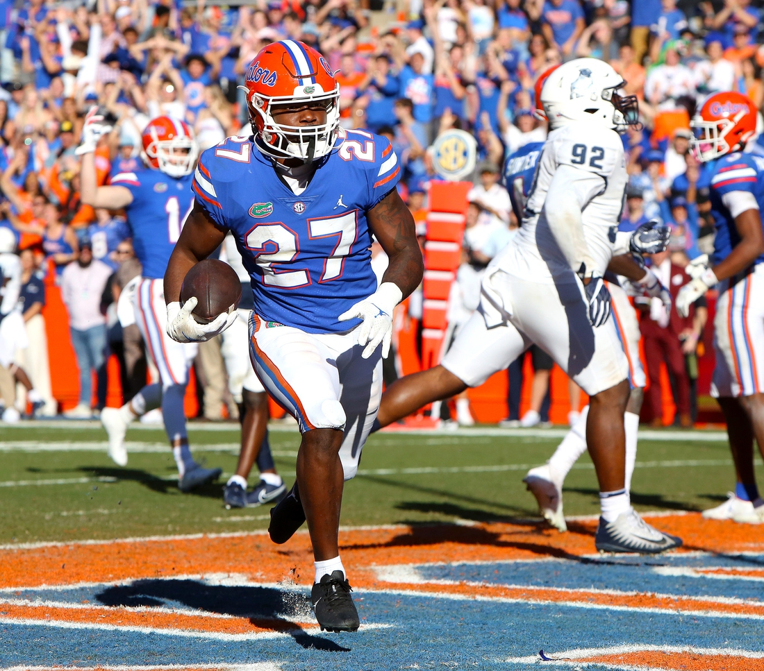 Florida Gators running back Dameon Pierce (27) scores a touchdown during a football game against Samford University, at Ben Hill Griffin Stadium in Gainesville Fla. Nov. 13, 2021.

Flgai Ufvssamford Action21