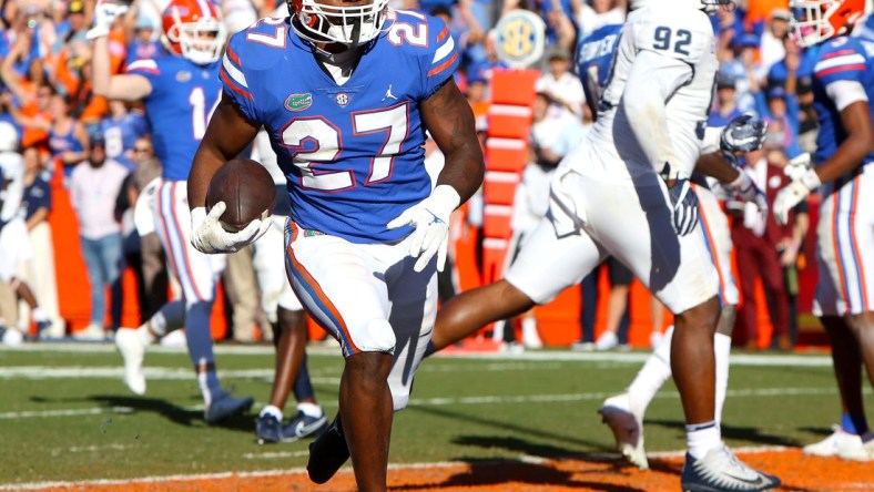 Florida Gators running back Dameon Pierce (27) scores a touchdown during a football game against Samford University, at Ben Hill Griffin Stadium in Gainesville Fla. Nov. 13, 2021.

Flgai Ufvssamford Action21