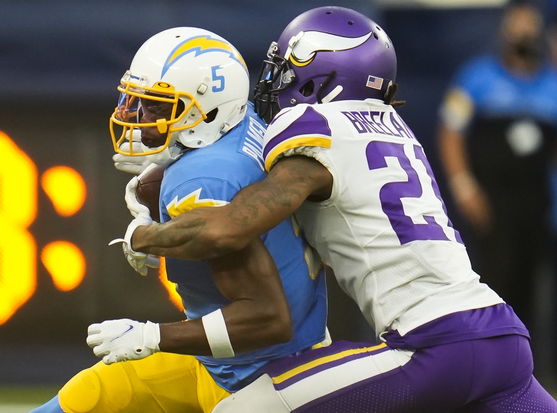 Nov 14, 2021; Inglewood, California, USA; Minnesota Vikings cornerback Bashaud Breeland (21) tackles Los Angeles Chargers wide receiver Josh Palmer (5) after a short gain in the fourth quarter at SoFi Stadium. Mandatory Credit: Robert Hanashiro-USA TODAY Sports