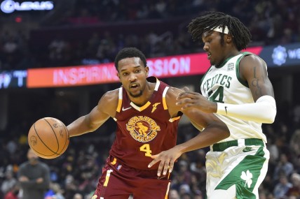 Nov 15, 2021; Cleveland, Ohio, USA; Cleveland Cavaliers center Evan Mobley (4) drives against Boston Celtics center Robert Williams III (44) in the second quarter at Rocket Mortgage FieldHouse. Mandatory Credit: David Richard-USA TODAY Sports