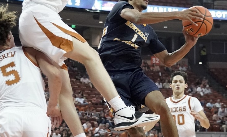 Nov 17, 2021; Austin, Texas, USA; Northern Colorado Bears guard Daylen Kountz (1) looks to pass the ball while defended by Texas Longhorns guard Avery Benson (21) during the second half at Frank C. Erwin Jr. Center. Mandatory Credit: Scott Wachter-USA TODAY Sports