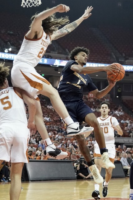 Nov 17, 2021; Austin, Texas, USA; Northern Colorado Bears guard Daylen Kountz (1) looks to pass the ball while defended by Texas Longhorns guard Avery Benson (21) during the second half at Frank C. Erwin Jr. Center. Mandatory Credit: Scott Wachter-USA TODAY Sports