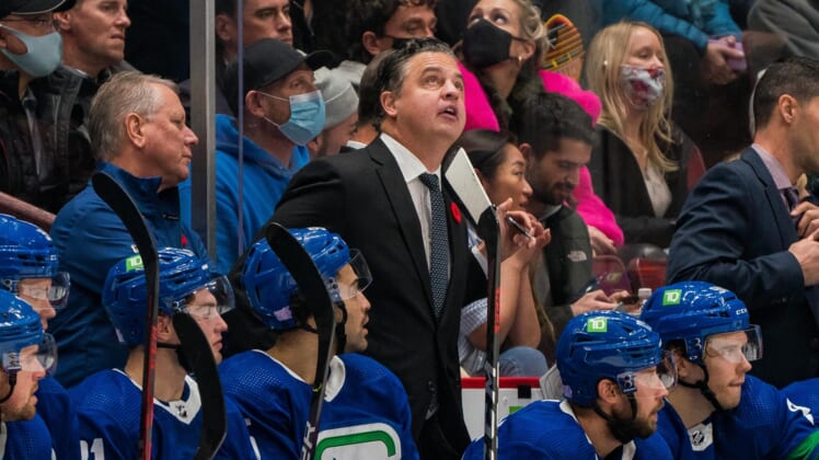 Nov 9, 2021; Vancouver, British Columbia, CAN; Vancouver Canucks head coach Travis Green on the bench against the Anaheim Ducks at Rogers Arena. Mandatory Credit: Bob Frid-USA TODAY Sports