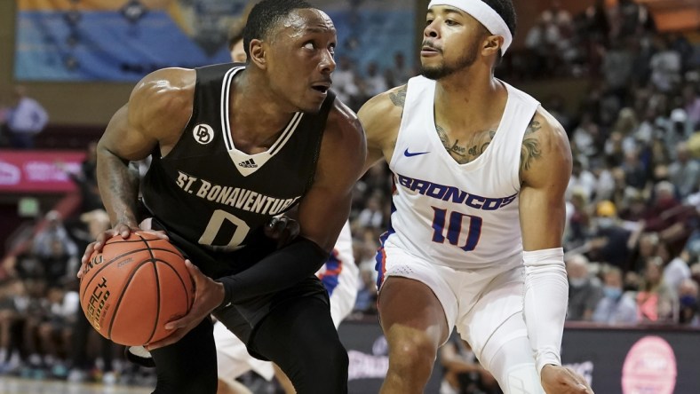 Nov 18, 2021; Charleston, South Carolina, USA; St. Bonaventure Bonnies guard Kyle Lofton (0) looks for a shot over Boise State Broncos guard Marcus Shaver Jr. (10) at TD Arena. Mandatory Credit: David Yeazell-USA TODAY Sports