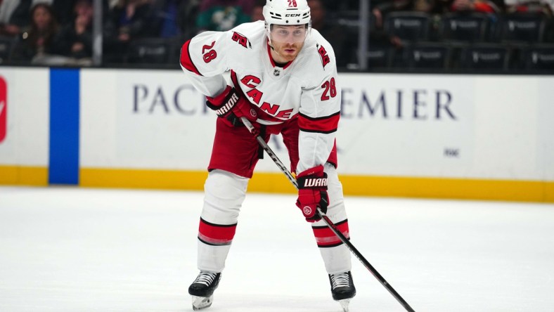 Nov 18, 2021; Anaheim, California, USA; Carolina Hurricanes defenseman Ian Cole (28) reacts against the Anaheim Ducks  in the first period at Honda Center. Mandatory Credit: Kirby Lee-USA TODAY Sports