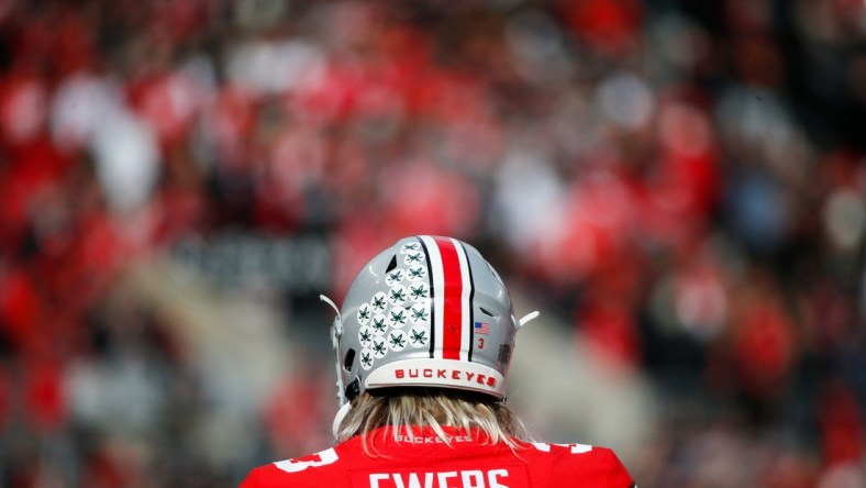 Sat., Nov. 20, 2021; Columbus, Ohio, USA; Ohio State Buckeyes quarterback Quinn Ewers (3) practices on the sideline during a break in play in the second quarter of a NCAA Division I football game between the Ohio State Buckeyes and the Michigan State Spartans at Ohio Stadium. Mandatory Credit: Joshua A. Bickel/Columbus Dispatch via USA TODAY Network.

Cfb Michigan State Spartans At Ohio State Buckeyes