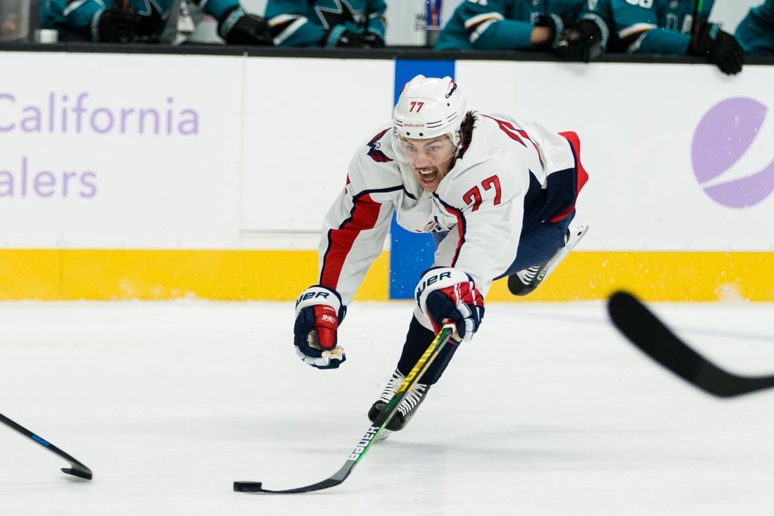 Nov 20, 2021; San Jose, California, USA; Washington Capitals right wing T.J. Oshie (77) dives for the puck against the San Jose Sharks during the fist period at SAP Center at San Jose. Mandatory Credit: John Hefti-USA TODAY Sports