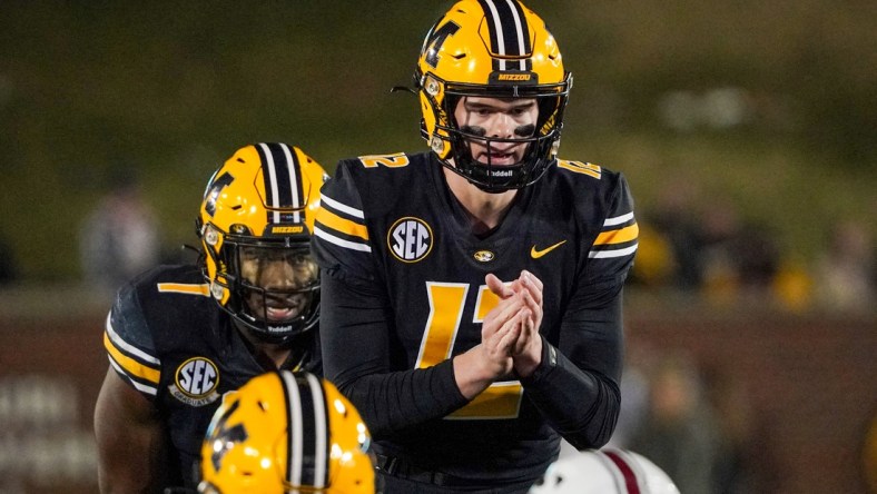 Nov 13, 2021; Columbia, Missouri, USA; Missouri Tigers quarterback Brady Cook (12) readies for the snap against the South Carolina Gamecocks during the game at Faurot Field at Memorial Stadium. Mandatory Credit: Denny Medley-USA TODAY Sports