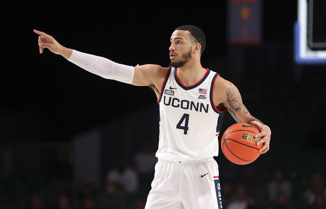 Nov 26, 2021; Nassau, BHS;  Connecticut Huskies guard Tyrese Martin (4) dribbles during the first half against the Virginia Commonwealth Rams in the 2021 Battle 4 Atlantis at Imperial Arena. Mandatory Credit: Kevin Jairaj-USA TODAY Sports