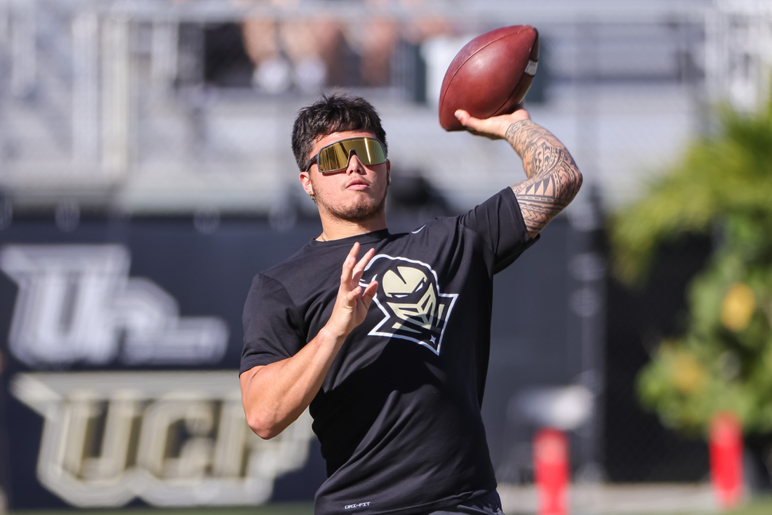 Nov 26, 2021; Orlando, Florida, USA; UCF Knights quarterback Dillon Gabriel (11) throws before the game against the South Florida Bulls at Bounce House. Mandatory Credit: Mike Watters-USA TODAY Sports