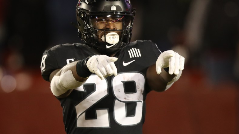 Nov 26, 2021; Ames, Iowa, USA; Iowa State Cyclones running back Breece Hall (28) celebrates after scoring a touchdown against the TCU Horned Frogs at Jack Trice Stadium. Mandatory Credit: Reese Strickland-USA TODAY Sports