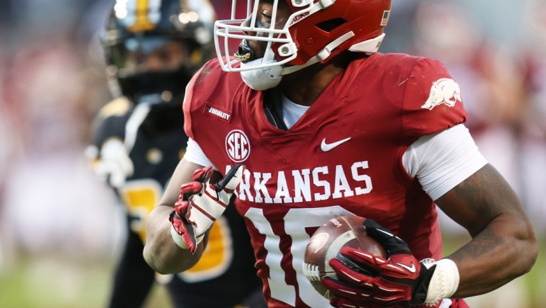 Nov 26, 2021; Fayetteville, Arkansas, USA; Arkansas Razorbacks wide receiver Treylon Burks (16) catches a pass and runs it in for a touchdown in the third quarter against the Missouri Tigers at Donald W. Reynolds Razorbacks Stadium. Mandatory Credit: Nelson Chenault-USA TODAY Sports