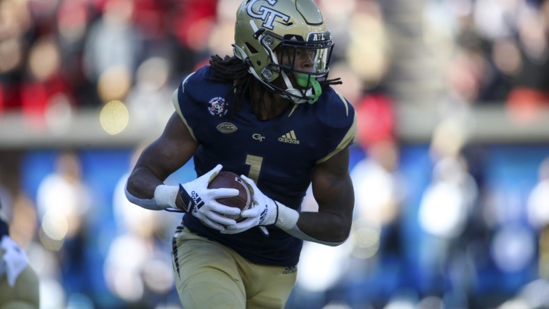 Nov 27, 2021; Atlanta, Georgia, USA; Georgia Tech Yellow Jackets running back Jahmyr Gibbs (1) runs the ball against the Georgia Bulldogs in the first quarter at Bobby Dodd Stadium. Mandatory Credit: Brett Davis-USA TODAY Sports