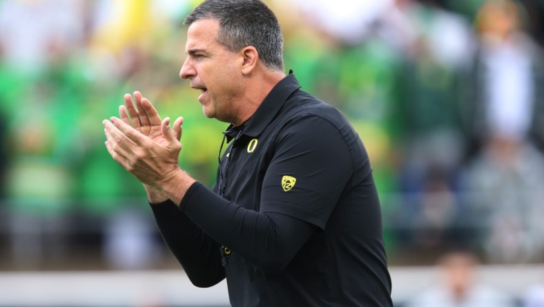 Oregon head coach Mario Cristobal oversees warmups before the game against Oregon State.

Eug 111427 Uofb 02