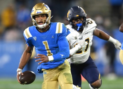 Nov 27, 2021; Pasadena, California, USA;    UCLA Bruins quarterback Dorian Thompson-Robinson (1) runs for 17 yards and a first down against the California Golden Bears in the second half at the Rose Bowl. Mandatory Credit: Jayne Kamin-Oncea-USA TODAY Sports