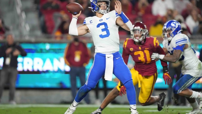 Nov 27, 2021; Los Angeles, California, USA; BYU Cougars quarterback Jaren Hall (3) throws the ball against the Southern California Trojans in the first half at United Airlines Field at Los Angeles Memorial Coliseum. Mandatory Credit: Kirby Lee-USA TODAY Sports