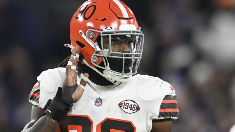 Nov 28, 2021; Baltimore, Maryland, USA;  Cleveland Browns defensive end Jadeveon Clowney (90) look sot the bench during the first half against the Baltimore Ravens at M&T Bank Stadium. Mandatory Credit: Tommy Gilligan-USA TODAY Sports