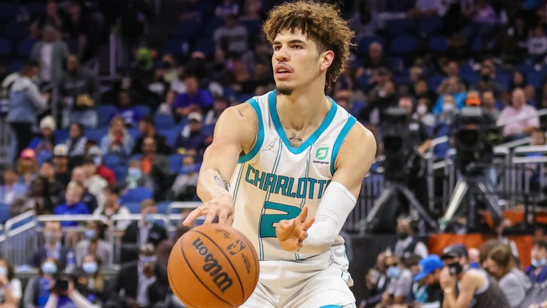 Nov 24, 2021; Orlando, Florida, USA; Charlotte Hornets guard LaMelo Ball (2) passes the ball during the first quarter against the Orlando Magic at Amway Center. Mandatory Credit: Mike Watters-USA TODAY Sports