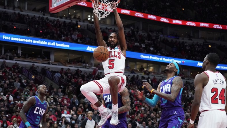 Nov 29, 2021; Chicago, Illinois, USA; Chicago Bulls forward Derrick Jones Jr. (5) dunks the ball against the Charlotte Hornets during the first half at United Center. Mandatory Credit: David Banks-USA TODAY Sports