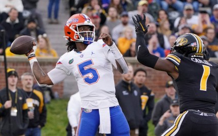 Nov 20, 2021; Columbia, Missouri, USA; Florida Gators quarterback Emory Jones (5) throws a pass as Missouri Tigers defensive back Jaylon Carlies (1) defends during the game at Faurot Field at Memorial Stadium. Mandatory Credit: Denny Medley-USA TODAY Sports