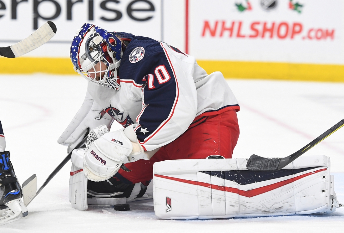 Nov 30, 2021; Nashville, Tennessee, USA; Columbus Blue Jackets goaltender Joonas Korpisalo (70) makes a save during the first period against the Nashville Predators at Bridgestone Arena. Mandatory Credit: Christopher Hanewinckel-USA TODAY Sports