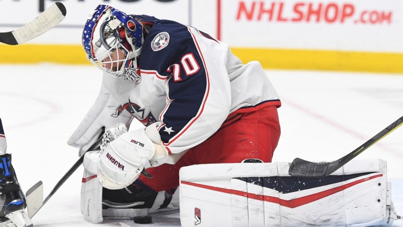 Nov 30, 2021; Nashville, Tennessee, USA; Columbus Blue Jackets goaltender Joonas Korpisalo (70) makes a save during the first period against the Nashville Predators at Bridgestone Arena. Mandatory Credit: Christopher Hanewinckel-USA TODAY Sports