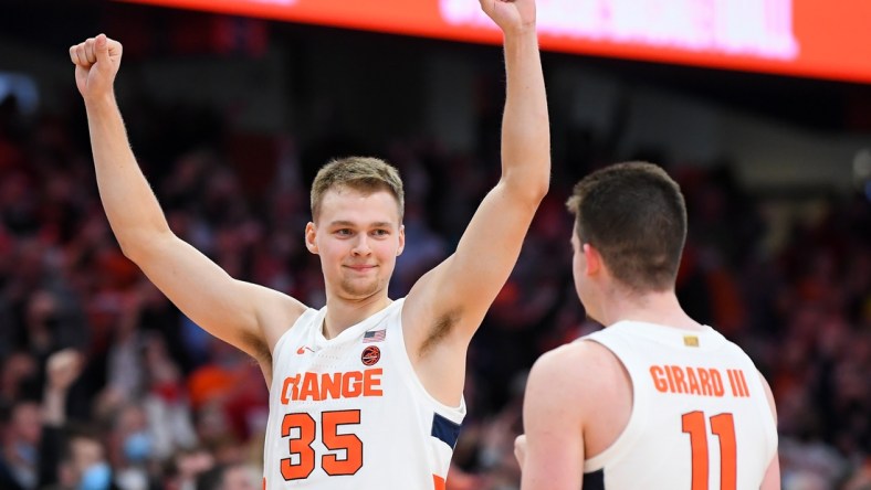 Nov 30, 2021; Syracuse, New York, USA; Syracuse Orange guard Buddy Boeheim (35) celebrates with teammate guard Joseph Girard III (11) following the game against the Indiana Hoosiers at the Carrier Dome. Mandatory Credit: Rich Barnes-USA TODAY Sports