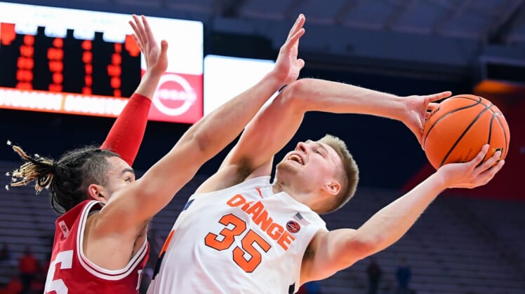 Nov 30, 2021; Syracuse, New York, USA; Syracuse Orange guard Buddy Boeheim (35) shoots the ball as Indiana Hoosiers guard Parker Stewart (left) defends during the second half at the Carrier Dome. Mandatory Credit: Rich Barnes-USA TODAY Sports