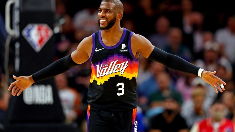 Nov 30, 2021; Phoenix, Arizona, USA; Phoenix Suns guard Chris Paul (3) reacts during the second quarter against the Golden State Warriors at Footprint Center. Mandatory Credit: Mark J. Rebilas-USA TODAY Sports