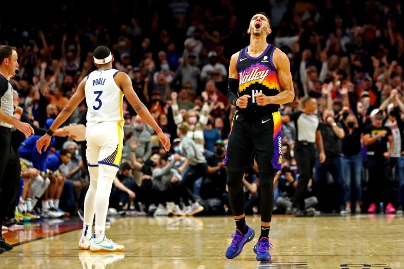 Nov 30, 2021; Phoenix, Arizona, USA; Phoenix Suns guard Landry Shamet (14) reacts during the fourth quarter against the Golden State Warriors at Footprint Center. Mandatory Credit: Mark J. Rebilas-USA TODAY Sports