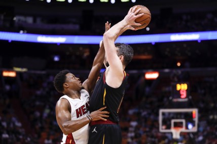 Dec 1, 2021; Miami, Florida, USA; Miami Heat guard Kyle Lowry (7) guards Cleveland Cavaliers forward Kevin Love (0) during the first quarter at FTX Arena. Mandatory Credit: Sam Navarro-USA TODAY Sports