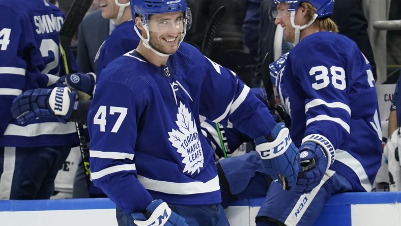 Dec 1, 2021; Toronto, Ontario, CAN; Toronto Maple Leafs defenseman Rasmus Sandin (38) congratulates Toronto Maple Leafs forward Pierre Engvall (47) after his goal against the Colorado Avalanche during the third period at Scotiabank Arena. Mandatory Credit: John E. Sokolowski-USA TODAY Sports