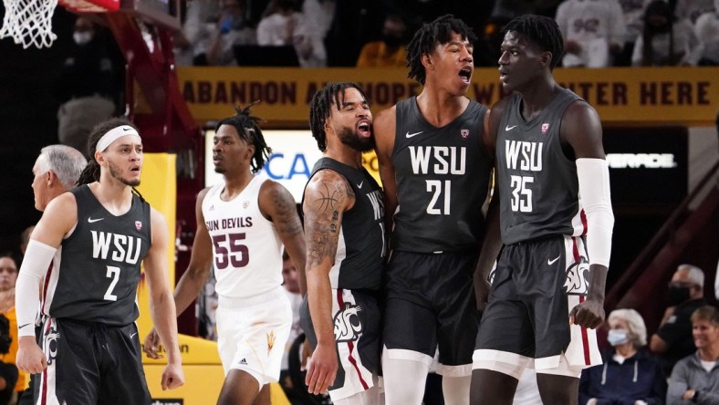 Dec 1, 2021; Tempe, Arizona, USA; Washington State Cougars center Dishon Jackson (21) and forward Mouhamed Gueye (35) react after their 51-29 victory over ASU at Desert Financial Arena. Mandatory Credit: Rob Schumacher-Arizona Republic

Ncaa Basketball Washington State At Arizona State