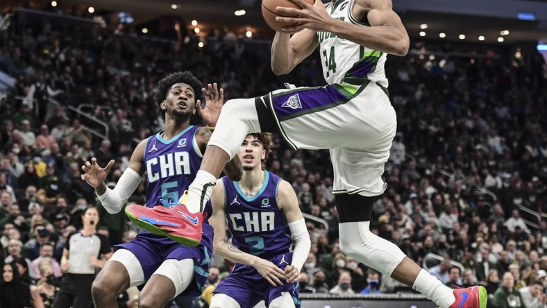 Dec 1, 2021; Milwaukee, Wisconsin, USA; Milwaukee Bucks forward Giannis Antetokounmpo (34) drives for the basket against Charlotte Hornets forward Jalen McDaniels (6) in the fourth quarter at Fiserv Forum. Mandatory Credit: Benny Sieu-USA TODAY Sports