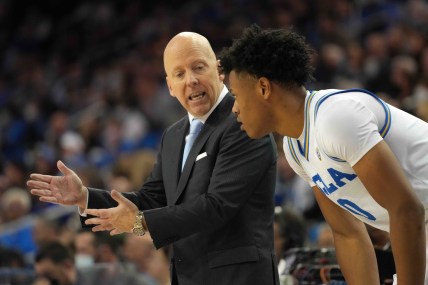 Dec 1, 2021; Los Angeles, California, USA; UCLA Bruins head coach Mick Cronin (left) talks with guard Jaylen Clark (0) against the Colorado Buffaloes in the second half at Pauley Pavilion. Mandatory Credit: Kirby Lee-USA TODAY Sports