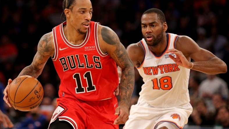 Dec 2, 2021; New York, New York, USA; Chicago Bulls forward DeMar DeRozan (11) controls the ball against New York Knicks guard Alec Burks (18) during the fourth quarter at Madison Square Garden. Mandatory Credit: Brad Penner-USA TODAY Sports