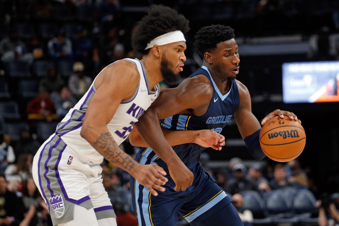 Nov 28, 2021; Memphis, Tennessee, USA; Memphis Grizzles forward Jaren Jackson Jr. (13) drives to the basket as Sacramento Kings forward Marvin Bagley III (35) defends during the second half at FedExForum. Mandatory Credit: Petre Thomas-USA TODAY Sports