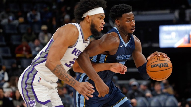 Nov 28, 2021; Memphis, Tennessee, USA; Memphis Grizzles forward Jaren Jackson Jr. (13) drives to the basket as Sacramento Kings forward Marvin Bagley III (35) defends during the second half at FedExForum. Mandatory Credit: Petre Thomas-USA TODAY Sports