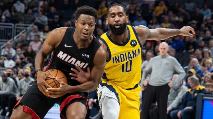 Dec 3, 2021; Indianapolis, Indiana, USA; Miami Heat guard Kyle Lowry (7) is fouled by Indiana Pacers guard Brad Wanamaker (10) in the first half at Gainbridge Fieldhouse. Mandatory Credit: Trevor Ruszkowski-USA TODAY Sports