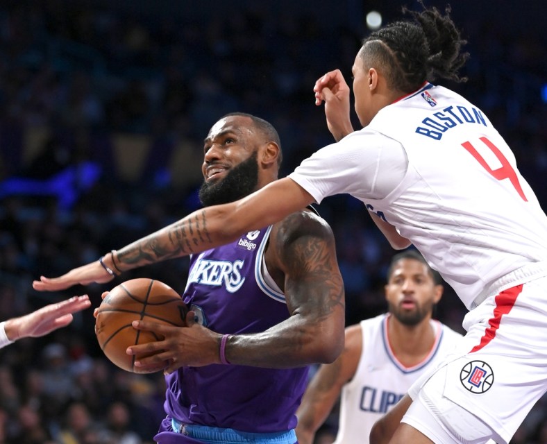 Dec 3, 2021; Los Angeles, California, USA; Los Angeles Lakers forward LeBron James (6) is fouled by Los Angeles Clippers guard Brandon Boston Jr. (4) as he goes up for a basket in the first half of the game at Staples Center. Mandatory Credit: Jayne Kamin-Oncea-USA TODAY Sports