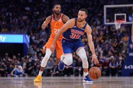 Dec 3, 2021; San Francisco, California, USA; Golden State Warriors guard Stephen Curry (30) dribbles past Phoenix Suns forward Mikal Bridges (25) in the fourth quarter at the Chase Center. Mandatory Credit: Cary Edmondson-USA TODAY Sports