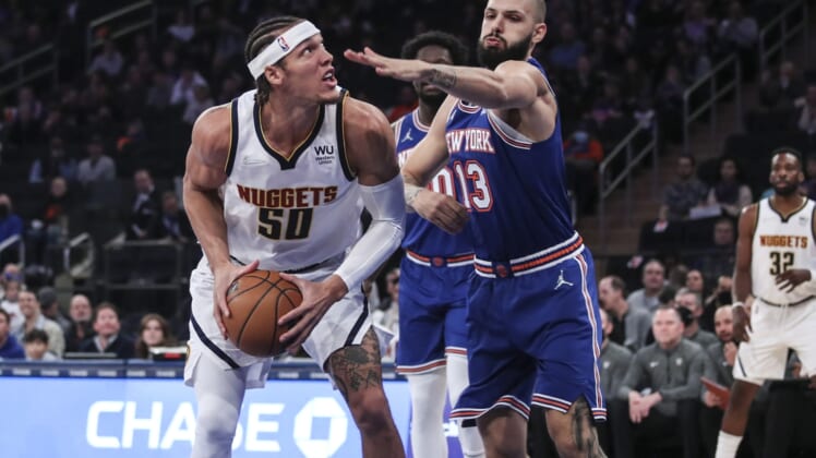 Dec 4, 2021; New York, New York, USA; Denver Nuggets forward Aaron Gordon (50) looks to score while defended by New York Knicks forward Evan Fournier (13) in the first quarter at Madison Square Garden. Mandatory Credit: Wendell Cruz-USA TODAY Sports