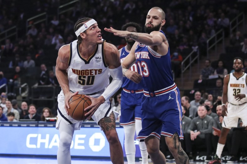 Dec 4, 2021; New York, New York, USA; Denver Nuggets forward Aaron Gordon (50) looks to score while defended by New York Knicks forward Evan Fournier (13) in the first quarter at Madison Square Garden. Mandatory Credit: Wendell Cruz-USA TODAY Sports